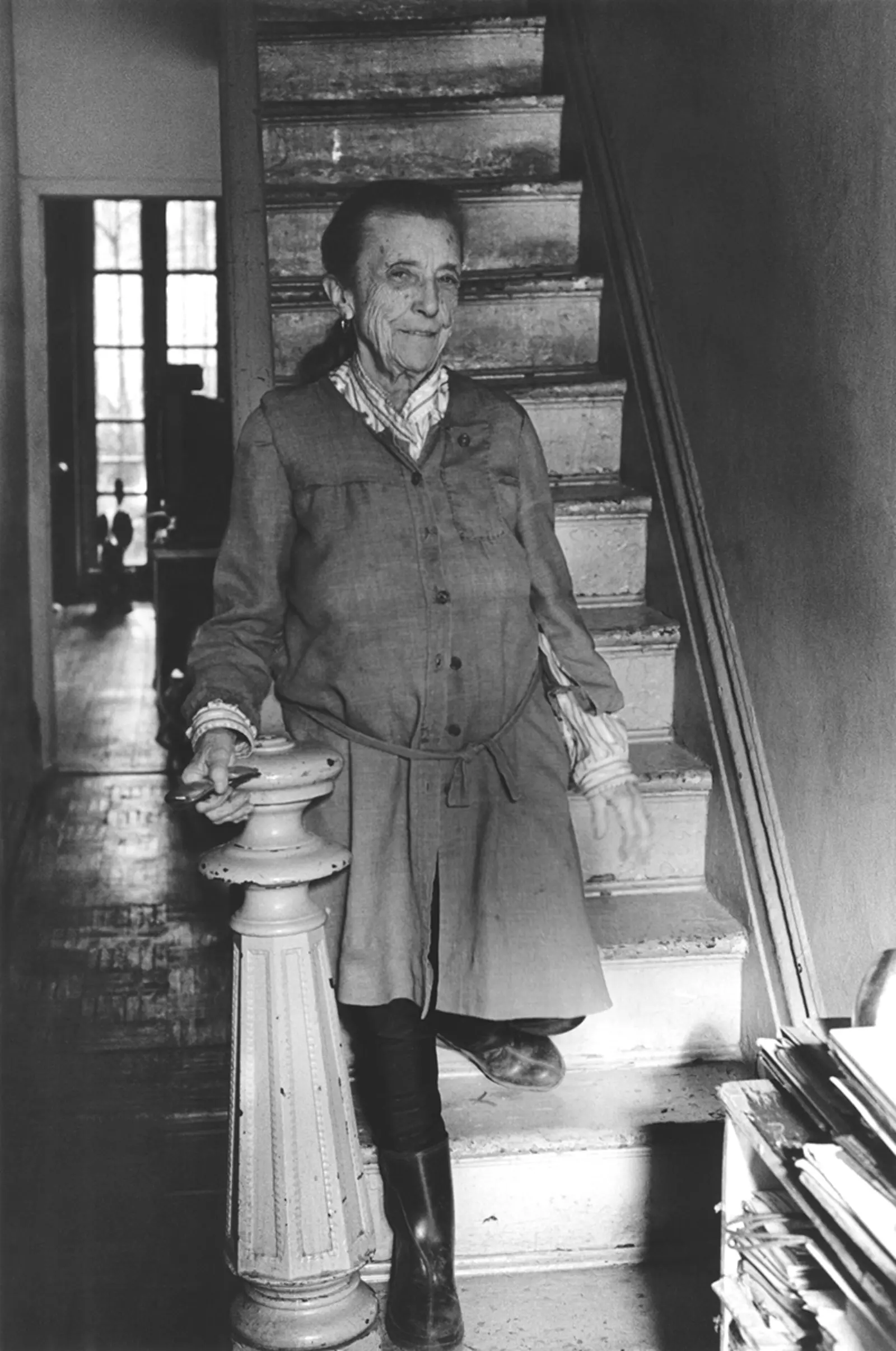 Louise Bourgeois descending the stairs in her home on West 20th Street, New York, 1992.